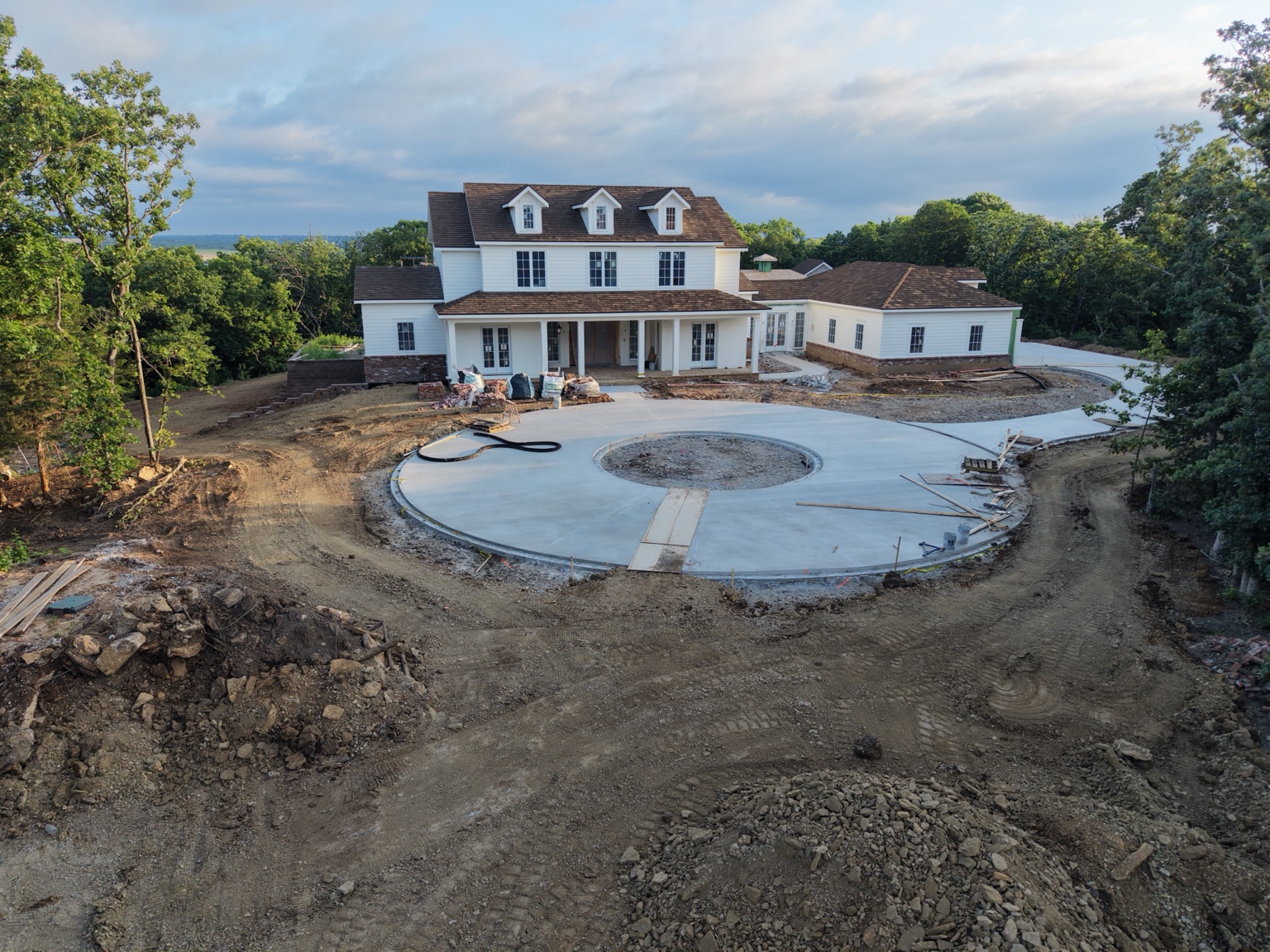 Front aerial view of a luxury custom home under construction